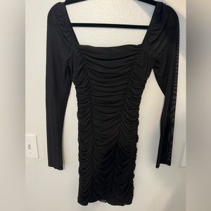 Leith black mini dress with sheer long sleeves.
